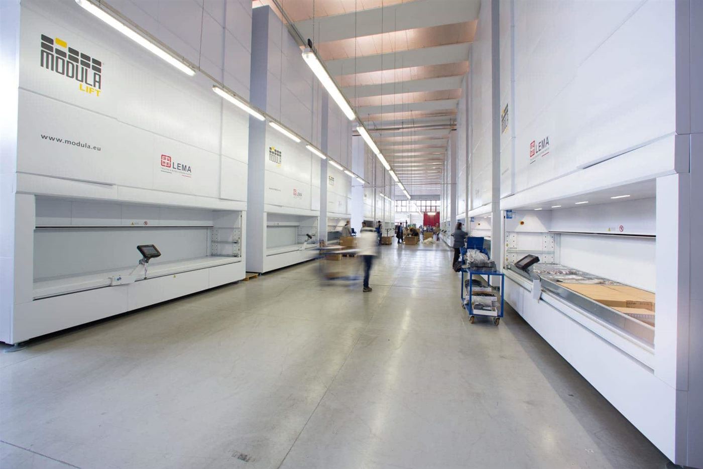 Row of Modula vertical lift modules with an operator at a pick bay